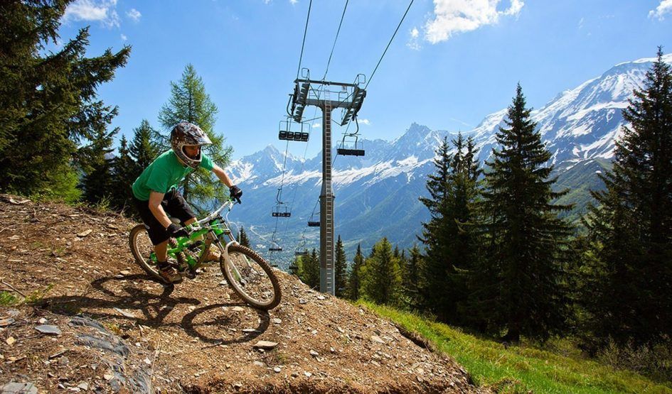 Chamonix has mountain biking to suit all standards. Photo Credit: Chamonet.com Mountain biking in Chamonix, with views of the Chamonix valley in the background