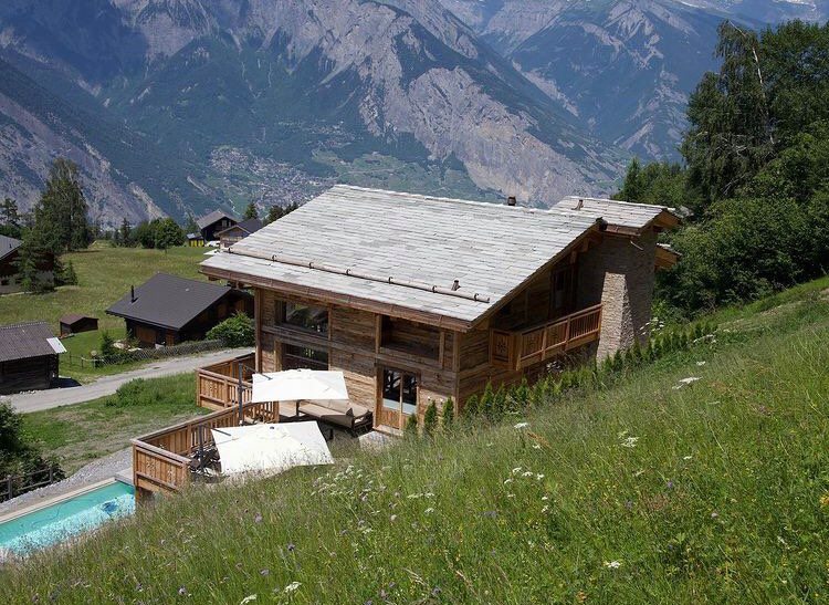 secluded chalets in Switzelrand, summer alpine retreat, remote chalets in Switzerland 