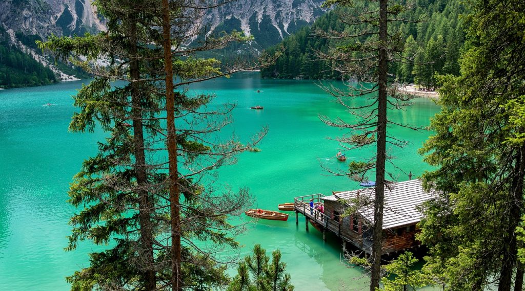 Most graphed lake in the Dolomites. Ariel image of Lake Braies with the cabin and rowing boats in view.