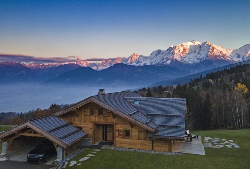 Exterior of Chalet Les Granges in Megeve, as well as the stunning mountains in the background; what a sight for a holiday with a view!