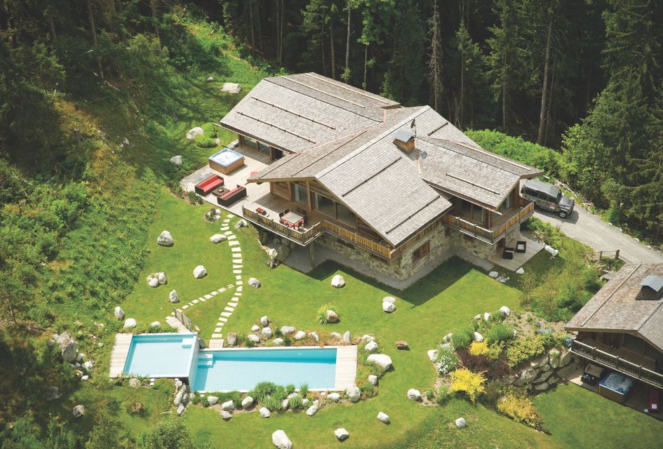 Chalet Amazon Creek, Chamonix. Bird's eye view of the tiered outdoor pool and gardens of the luxury Chalet Amazon Creek in Chamonix.