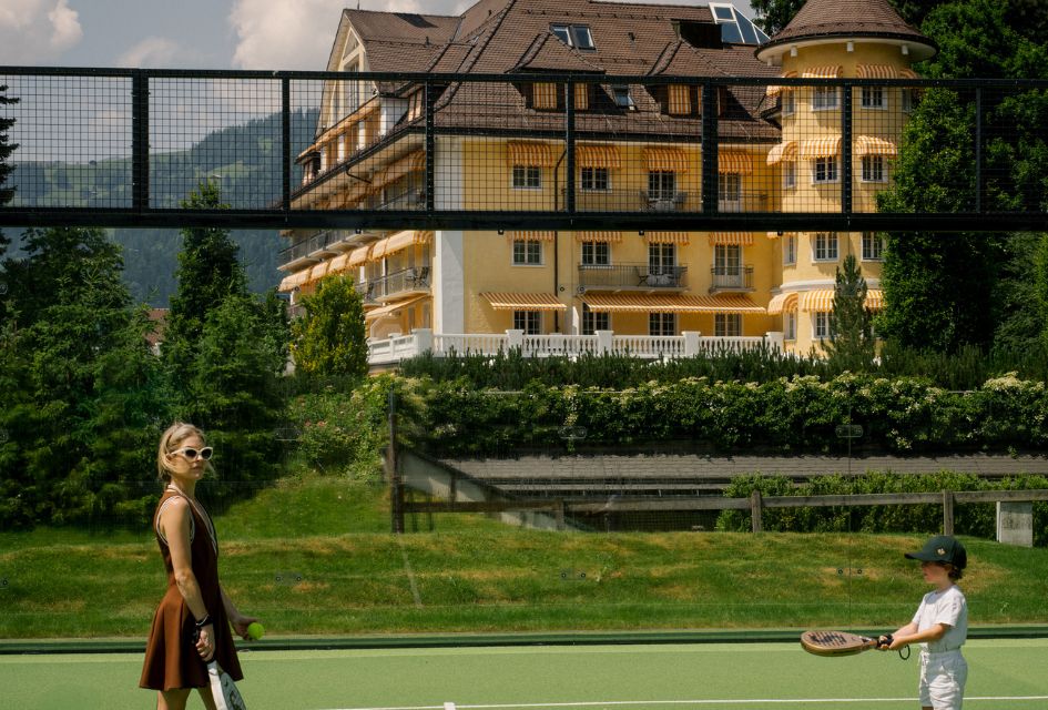 A family playing on the stunning padel courts near the centre of Gstaad. A great summer day out.