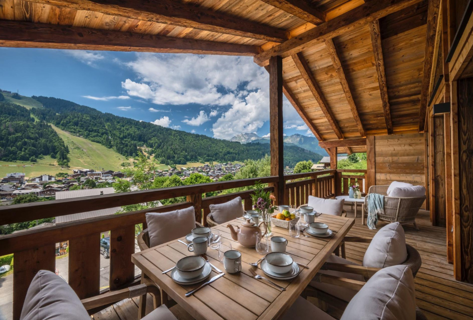 Chalet Genevieve, Morzine Dine alfresco on the spacious terrace where small groups can sit together and admire the stunning summer views ahead.