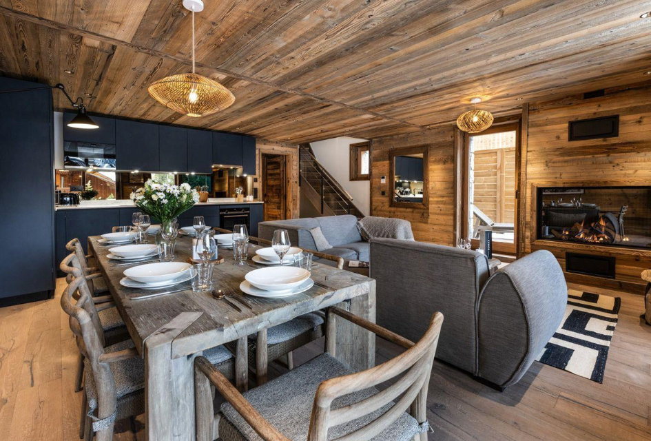Falcon Lodge F12, Méribel The open-plan living areas, featuring the stylish kitchen, dining table and living room, where guests can sit back and unwind together.