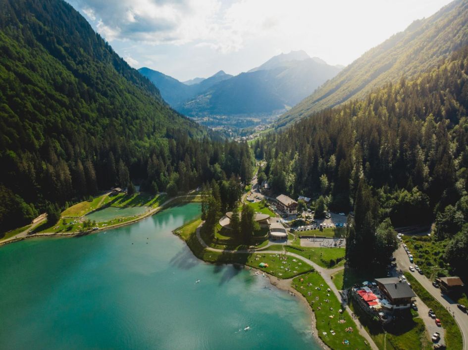 Views overlooking Lake Montriond and forest mountains in the distance.