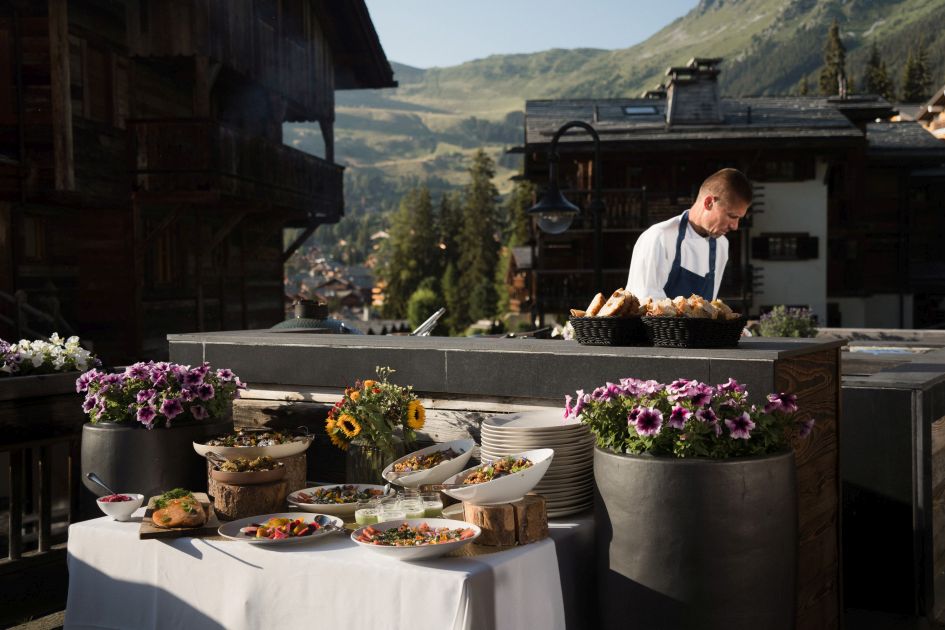 The Lodge Catering Private chef at The Lodge preparing a gourmet meal for guests on the spacious terrace.