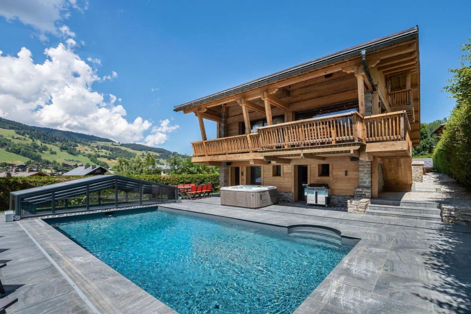 Gorgeous terrace area with an outdoor swimming pool and hot tub.