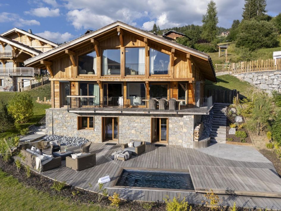 Chalet Avalon, Les Gets Chalet Avalon's spacious sun-drenched terrace with outdoor seating and a gorgeous outdoor hot tub.